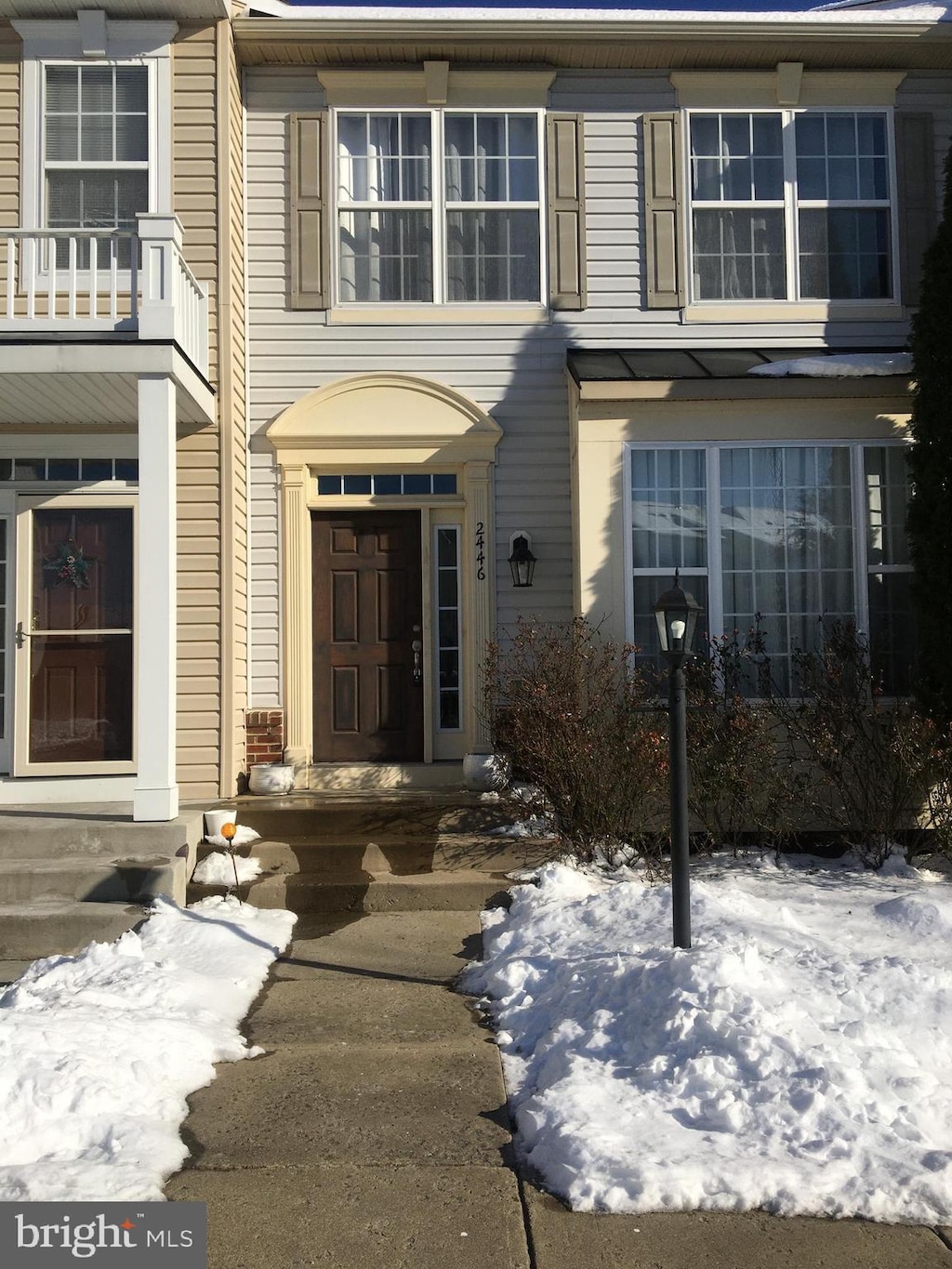 view of snow covered property entrance