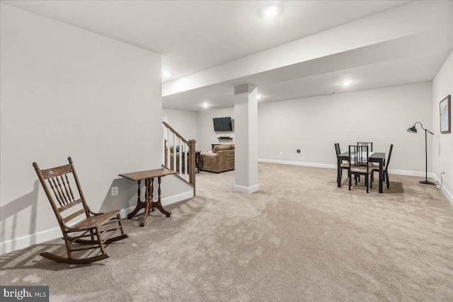 living area with light colored carpet