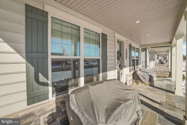 view of patio / terrace with covered porch and a grill