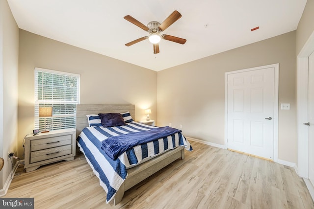 bedroom featuring ceiling fan and light wood-type flooring