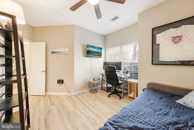 home office featuring hardwood / wood-style flooring and ceiling fan