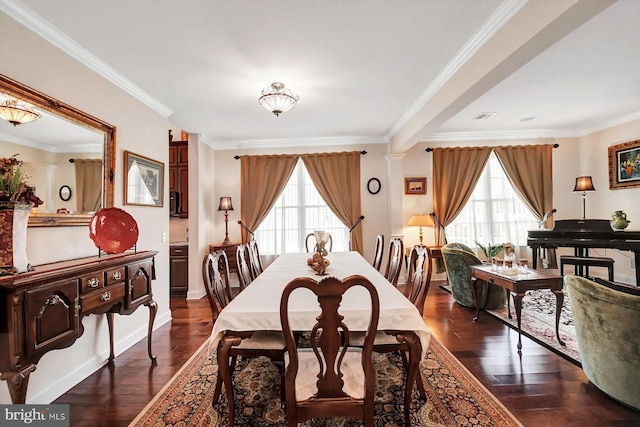 dining space featuring crown molding, a healthy amount of sunlight, and dark hardwood / wood-style flooring