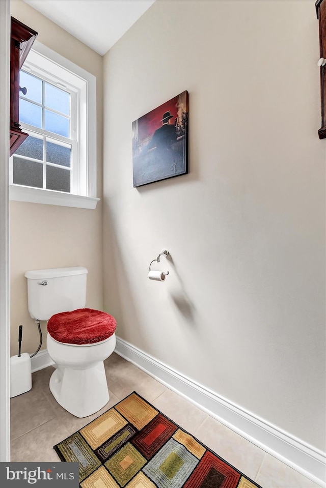 bathroom with tile patterned floors and toilet