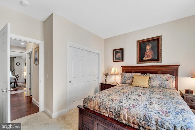 carpeted bedroom with a closet