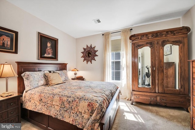 bedroom with light colored carpet