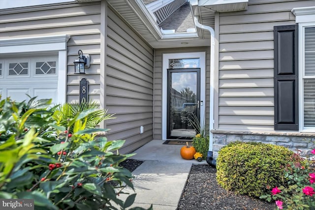 property entrance featuring a garage