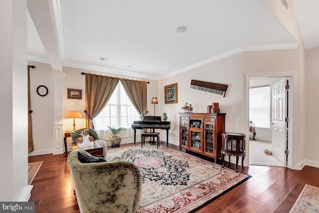 living room with ornamental molding and dark hardwood / wood-style floors