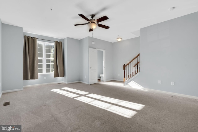 interior space with ceiling fan