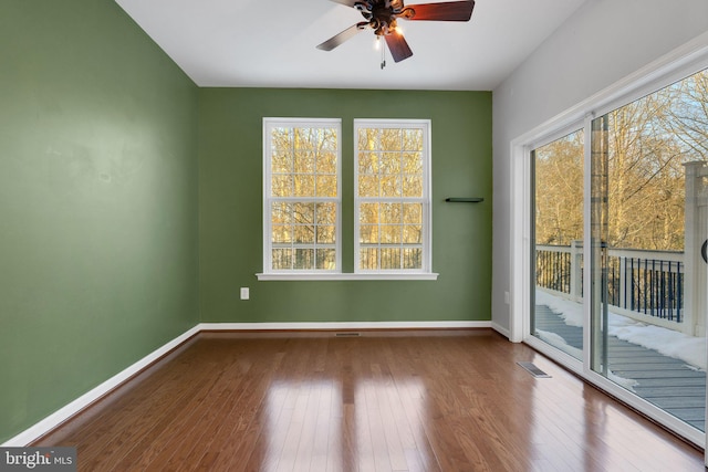 spare room featuring ceiling fan and hardwood / wood-style floors