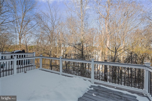 view of snow covered deck