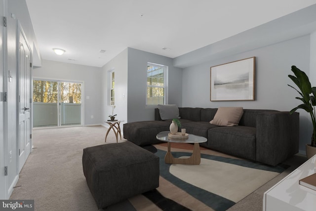 carpeted living room featuring a wealth of natural light