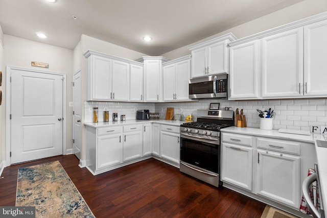 kitchen with stainless steel appliances and white cabinets