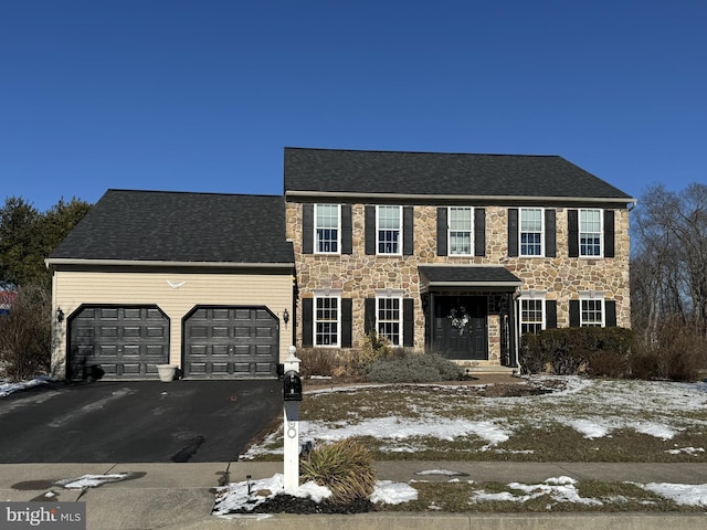 colonial home with a garage