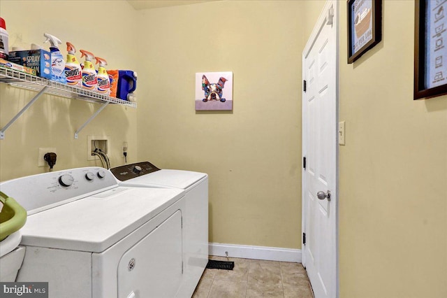 washroom featuring light tile patterned flooring and washing machine and dryer