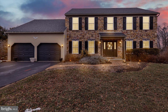 colonial home featuring a garage