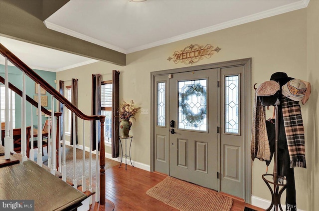 entryway featuring hardwood / wood-style flooring and ornamental molding