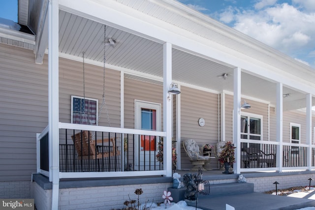 property entrance featuring covered porch