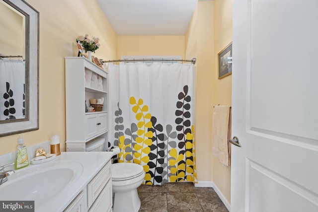 bathroom featuring toilet, a shower with curtain, and vanity