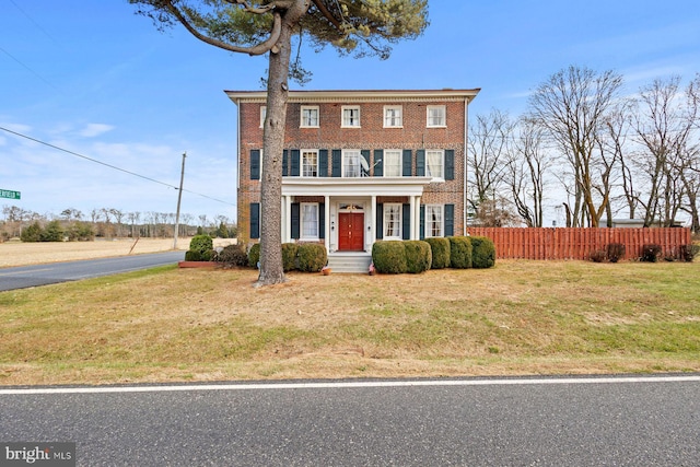 view of front of home with a front lawn