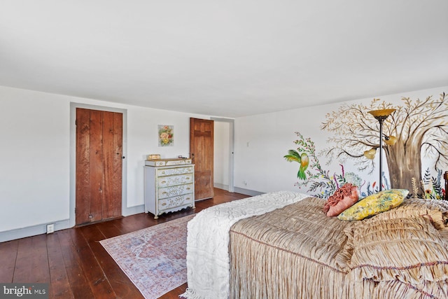 bedroom with dark wood-type flooring