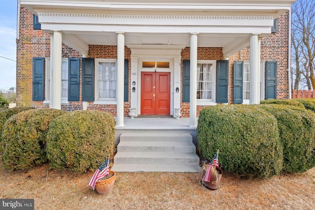 doorway to property with covered porch