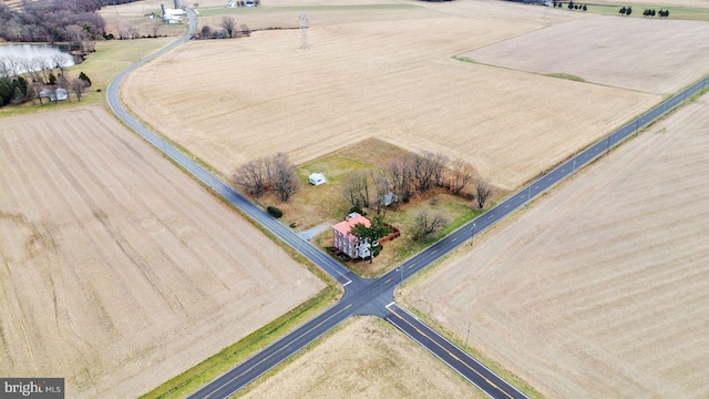 birds eye view of property with a rural view