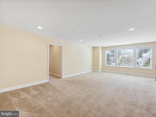 empty room with light colored carpet