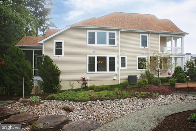 rear view of property featuring cooling unit