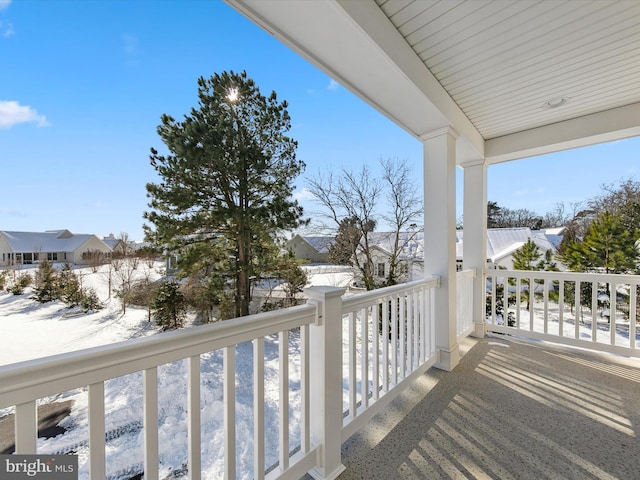 view of snow covered deck