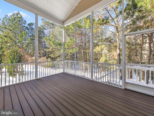 unfurnished sunroom with plenty of natural light and lofted ceiling