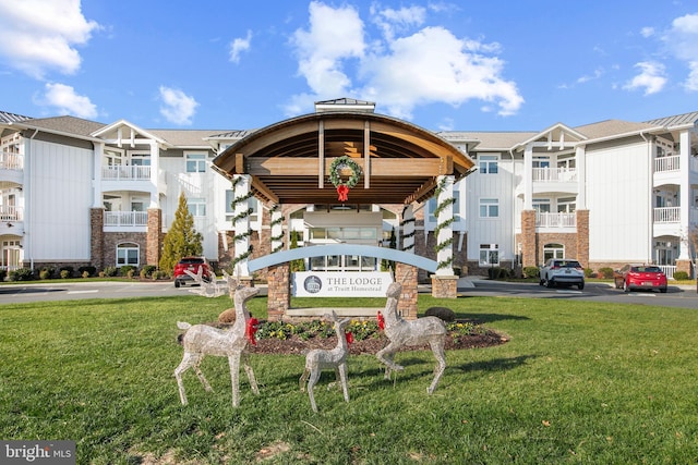 view of property's community with a lawn