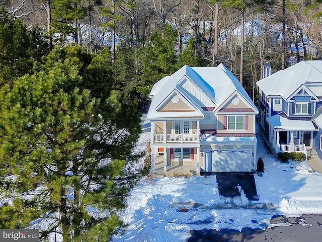 view of front of property with a balcony and a garage