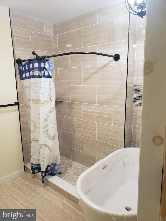 bathroom featuring curtained shower and sink