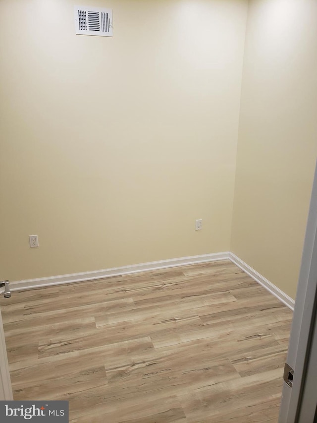 unfurnished room with light hardwood / wood-style floors