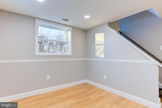 spare room with hardwood / wood-style flooring