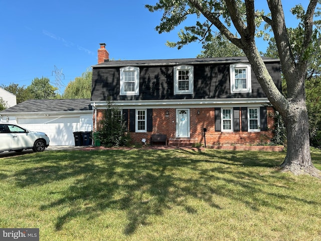 view of front of home with a garage and a front yard