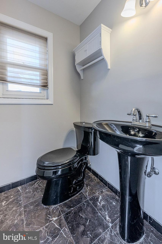 bathroom with sink and toilet