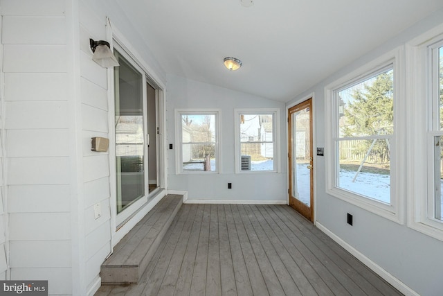 unfurnished sunroom with lofted ceiling