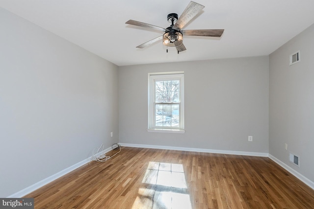 spare room featuring ceiling fan and wood-type flooring