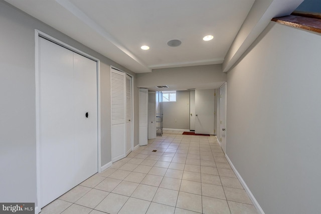 hallway with light tile patterned floors