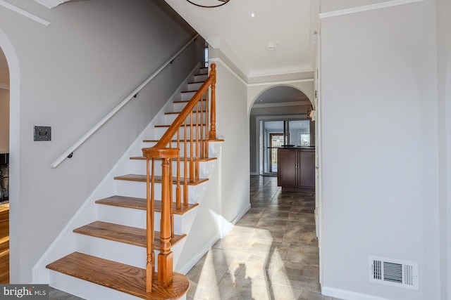 stairway with crown molding