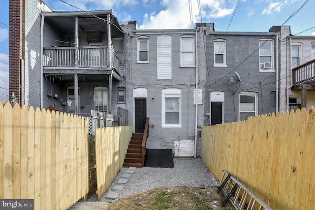 view of front of house with a balcony