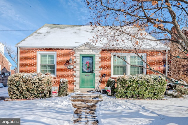 view of front of property with stone siding and brick siding