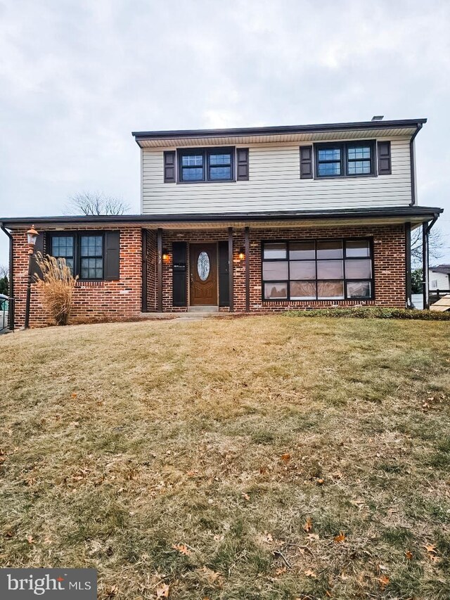 front facade with a front yard