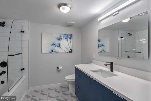 full bathroom with tiled shower / bath combo, vanity, and toilet