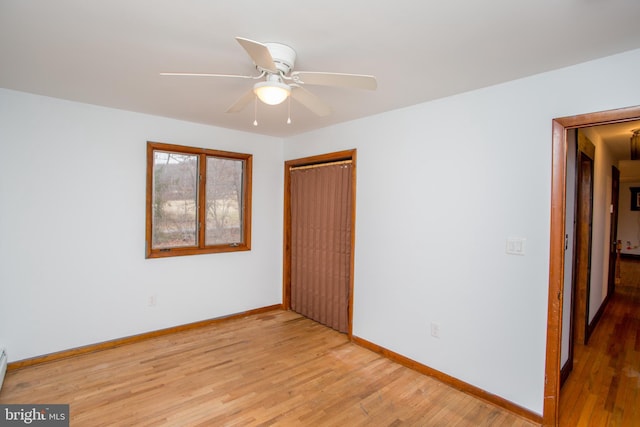 unfurnished room with light hardwood / wood-style floors and ceiling fan