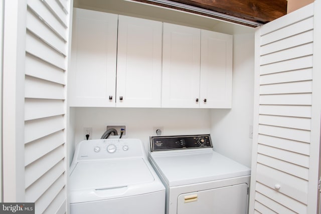 laundry room with cabinets and independent washer and dryer