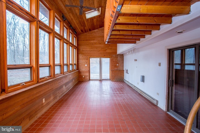 unfurnished sunroom with wooden ceiling, beam ceiling, a skylight, and a baseboard heating unit