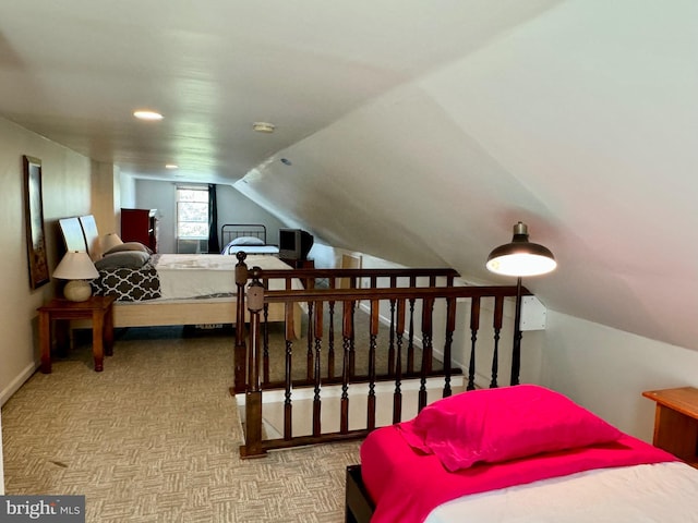 carpeted bedroom featuring vaulted ceiling