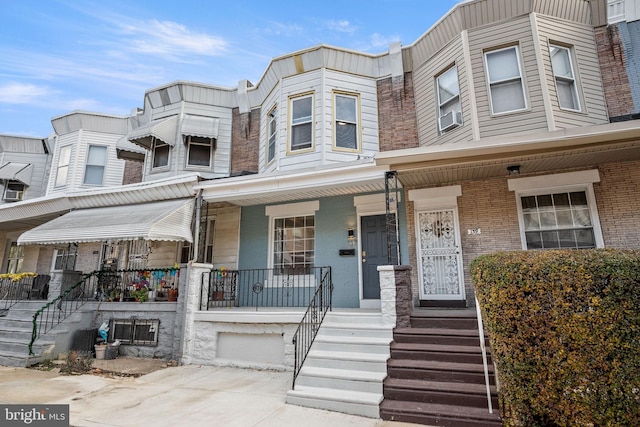 townhome / multi-family property with covered porch